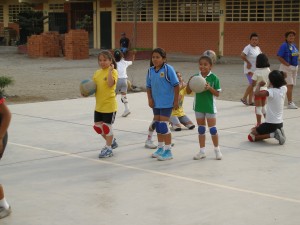 A small group of students playing Volleyball after classes